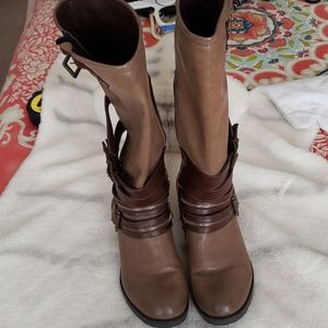 Brown combat boots with gold accents.